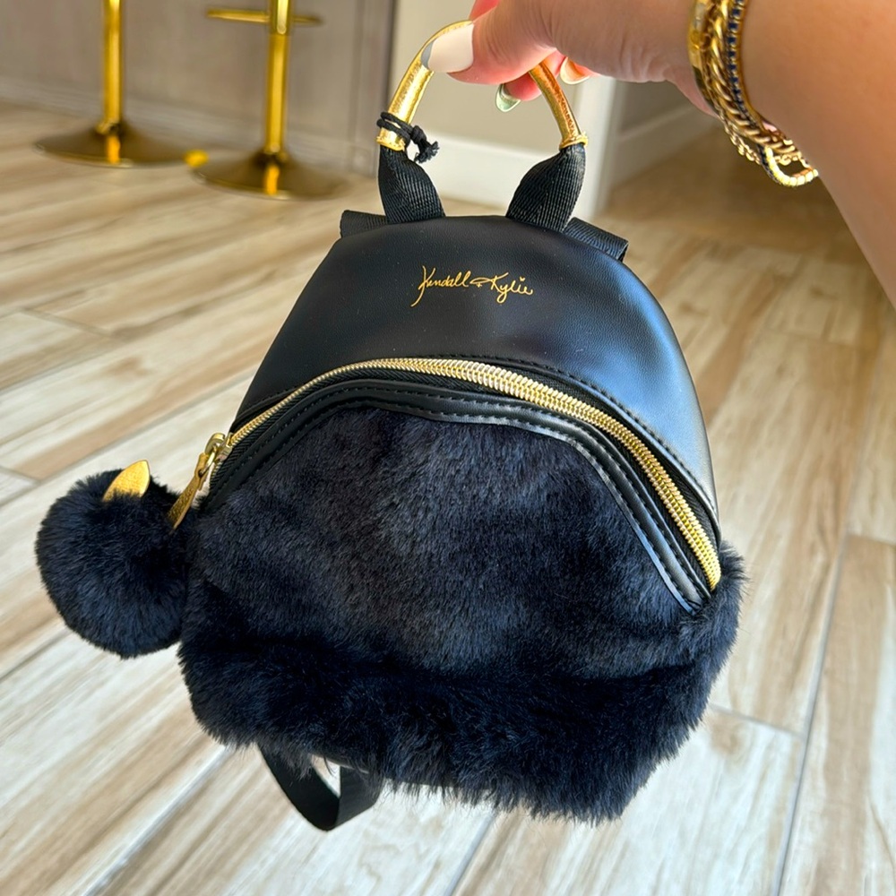 NWT Kendall + Kylie Black Faux Fur Mini Backpack Gold Hardware Pom Pom Bag